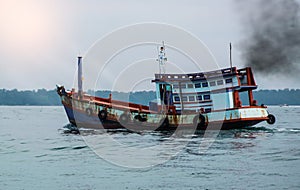 Combustion fumes coming out of transport boat exhaust pipe, air pollution concept