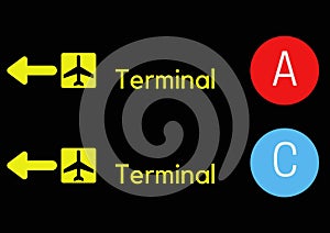 A black sign with yellow text for terminal airpor. photo