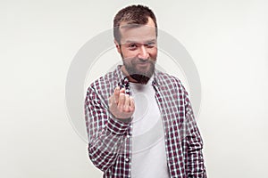 Come here sign. Portrait of friendly bearded man inviting to approach doing beckoning gesture. isolated on white background