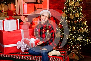 come home at Christmas. happy new year. child in red santa hat. kid with present box. winter shopping sale. cheerful