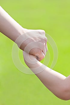 Come with me. Hands of father guiding his son photo