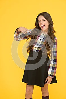 Come with me. Hey you. Manners of hothead. Girl long hair cool pointing forward. Child pointing camera yellow background