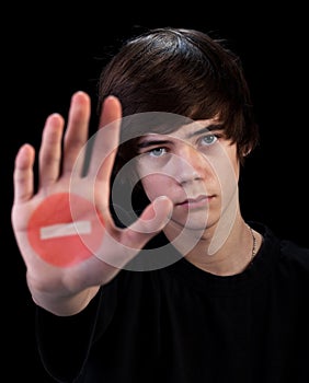 Come no further - teenager boy with sign on hand