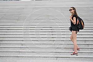 Come and see. Girl tourist stairs. Ready explore city. Woman sporty black outfit walking. Vacation and travel concept