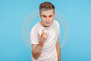 Come to me! Portrait of handsome man in casual white t-shirt making beckoning gesture and looking at camera with alluring eyes