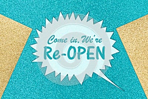 Come in weâ€™re re-open message on teal sparkle paper