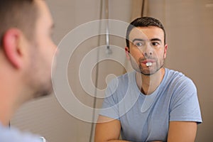 Comedic man playing with rabbit teeth