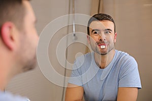 Comedic man playing with rabbit teeth