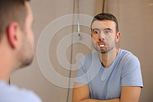 Comedic man playing with rabbit teeth