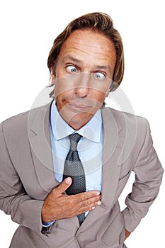 Comedy, crazy and man portrait of a business man with a silly face and suit with white background. Comic, joke and