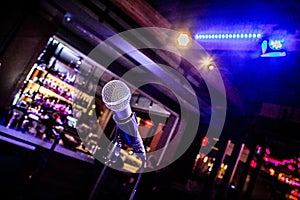 Comedy or Music Show at Night with  Microphone and Blue Lights Nightlife.