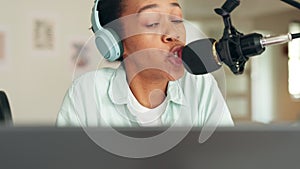 Comedy podcast influencer woman speaking on radio microphone, headphones for audio digital show or broadcast. Celebrity