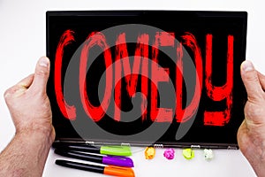Comedy text written on tablet, computer in the office with marker, pen, stationery. Business concept for Stand Up Comedy Microphon