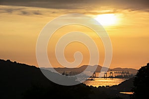 Comercial container port at sunset