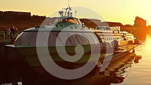 Comet hydrofoil vessel in dock at sunset pan