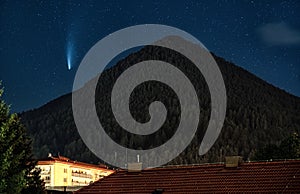 Comet Neowise over hill Cebrat in town Ruzomberok, Slovakia