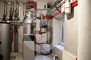 comfort House. boiler, water heater, expansion tank and other pipes. modern independent heating system in boiler room