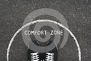 Comfort zone concept. Feet standing inside comfort zone circle