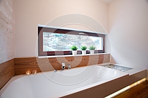 Comfortable bath in elegant bathroom