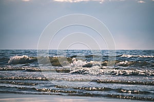 comfortable beach of the baltic sea with rocks and green vegetat