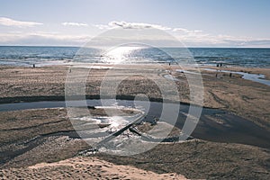 comfortable beach of the baltic sea with rocks and green vegetat