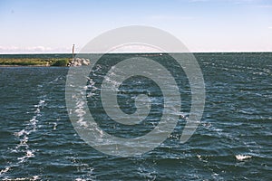 comfortable beach of the baltic sea with rocks and green vegetat