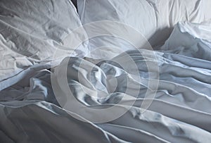 Comfortable bed with soft white pillows