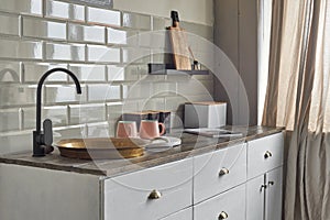 Comfortable elegant kitchen counter with sink at country house.