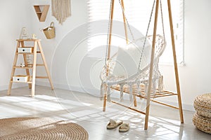 Comfortable hammock chair in stylish room. Home interior