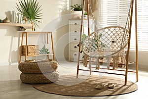 Comfortable hammock chair in stylish room. Interior design