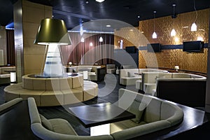 Comfortable lounge zone in luxury interior in hotel lobby or restaraunt with sofas and tables