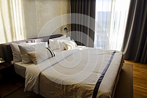 Comfortable luxury hotel room with sunlight in the morning