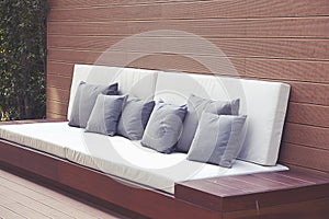 Comfortable modern corner couch sofa with many pillows