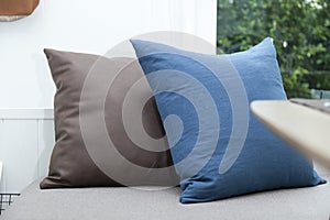 Comfortable modern corner couch sofa with many pillows