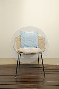 Comfortable pillows on wicker chair