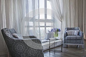 Comfortable room corner, two chair and tea table by the window