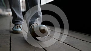 comfortable shoes for city walks, closeup of feet of city dweller, walking alone