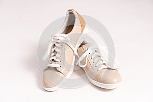 Comfortable sneakers made of beige genuine leather