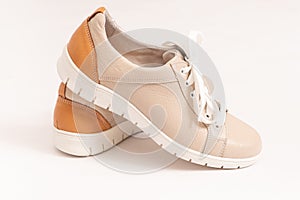Comfortable sneakers made of beige genuine leather