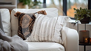 Comfortable sofa with pillows in living room, closeup view. Light neutral colors