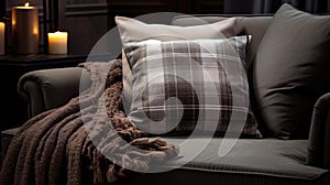 Comfortable sofa with plaid and candles in dark room, closeup.