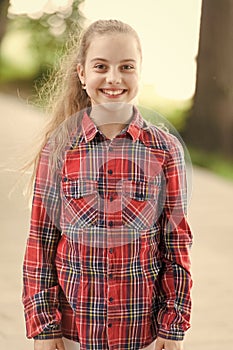 Comfortable to wear and timelessly stylish. Happy stylish child. Little cute girl with long blond hair wearing stylish photo