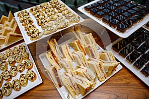 Comfortable triangular sandwiches on the banquet table