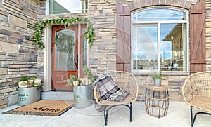 Comfortable wicker chairs on a veranda day light