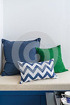 comfrotable bench with set of pillows