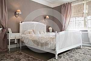 Comfy bedroom inside a residence photo