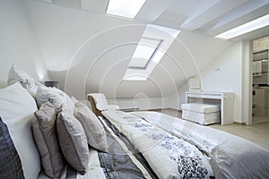 Comfy enormous bed in bright bedroom