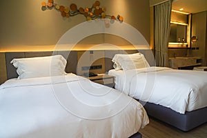 comfy twin bed in luxury hotel for rest in holidays