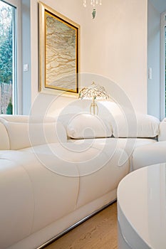 Comfy white couch inside crystal interior photo