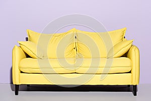 comfy yellow couch in front of